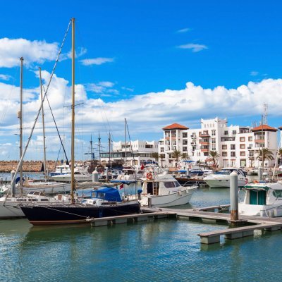 Boats at the Marina harbour in Agadir. Agadir is a major city in Morocco located on the shore of the Atlantic Ocean, near the Atlas Mountains.