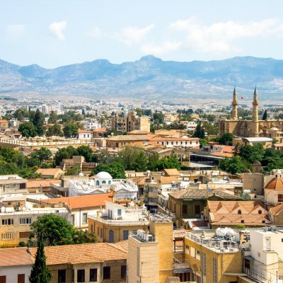 NICOSIA, CYPRUS - JUNE 3, 2014: Aerial view on Larnaca with Greek part in front, Turkish behind and Green Line in the middle, on June 3, 2014. Nicosia is divided into two nations since Turkish occupation in 1974.