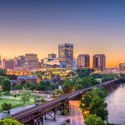 Richmond, Virginia, USA downtown skyline on the river at twilight.